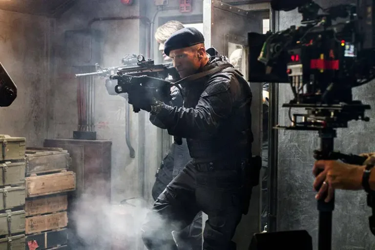 Jason Statham with gun in film