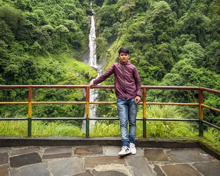 Dipesh K. Shrestha near waterfall
